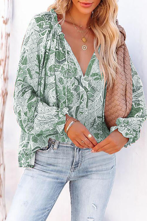 Floral tie neck flounce sleeve blouse.