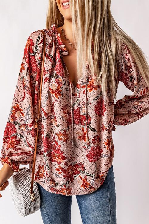 Floral tie neck flounce sleeve blouse.