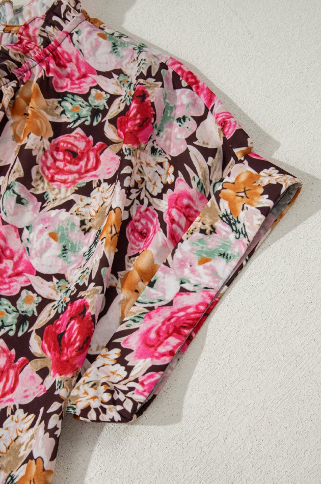 Floral tie neck short sleeve blouse with frill.