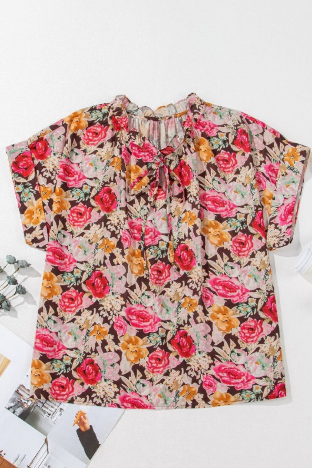 Floral tie neck short sleeve blouse with frill.