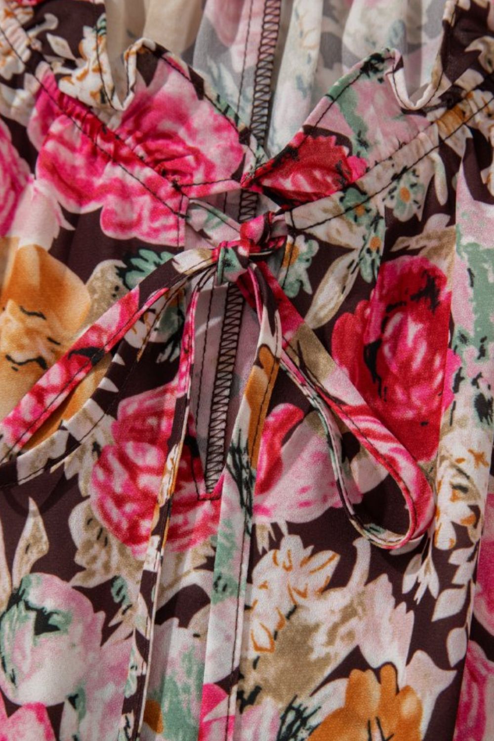 Floral tie neck short sleeve blouse with frill.