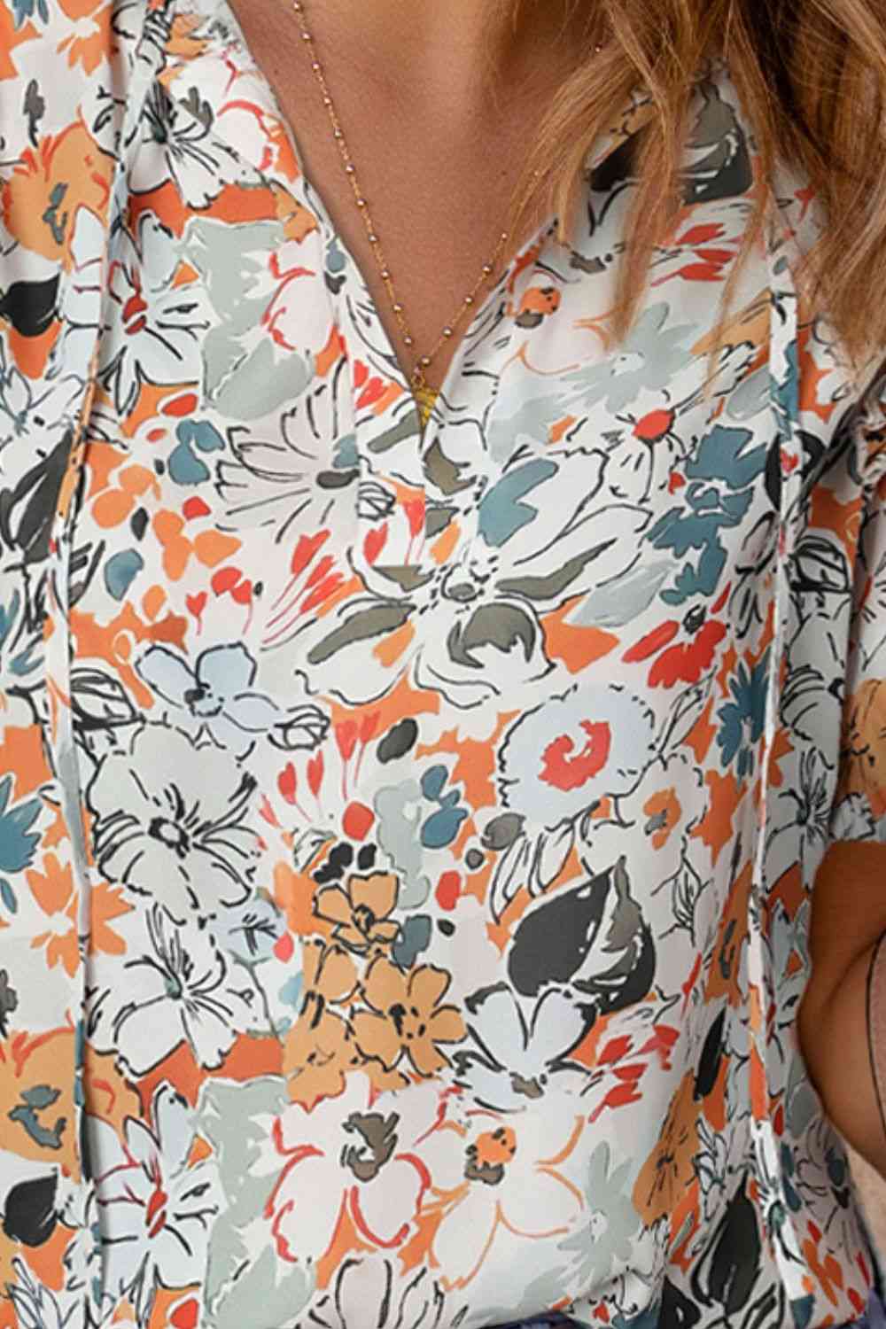 Floral tie neck shoulder detail blouse.