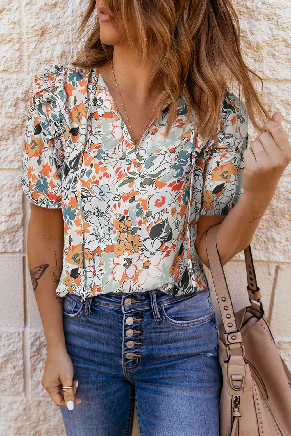 Floral tie neck shoulder detail blouse.