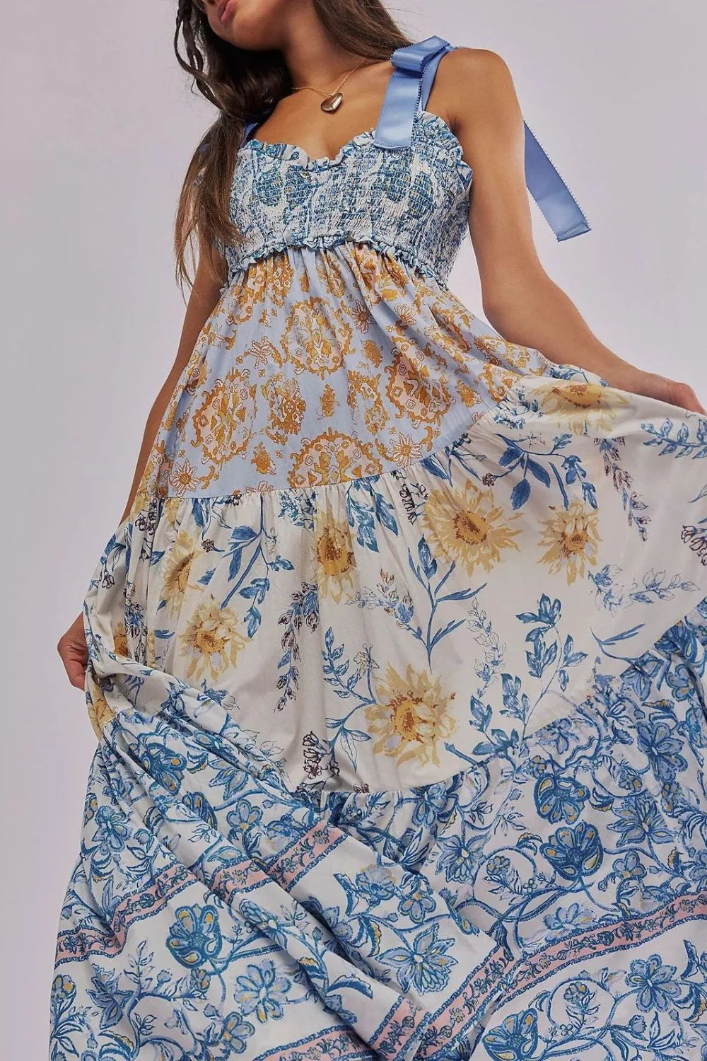 Floral Tiered Maxi Dress with Mixed Print Design.