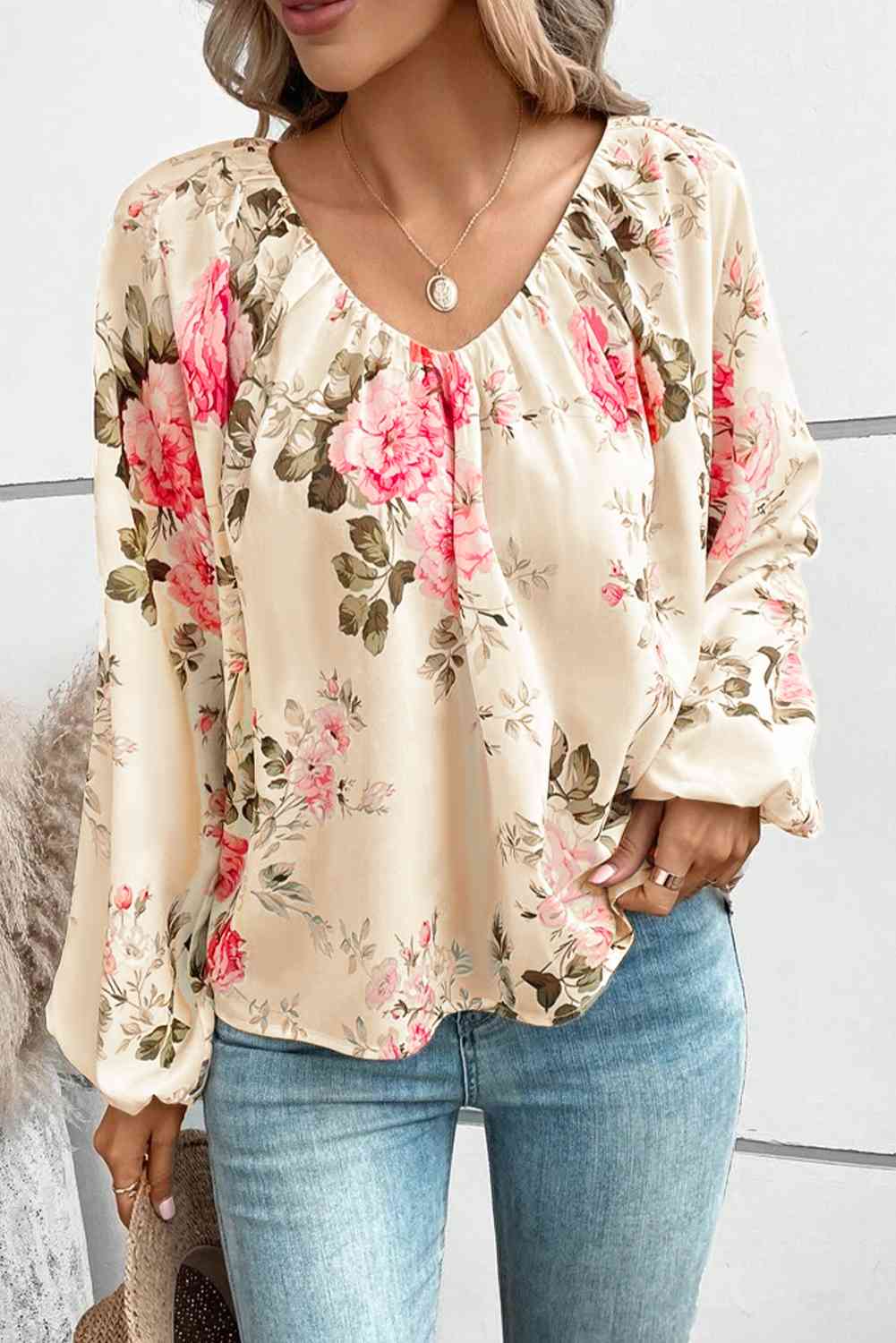 Floral V-neck balloon sleeve blouse.