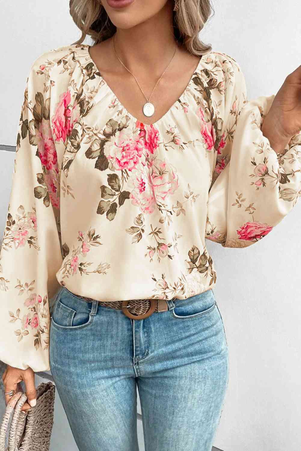 Floral V-neck balloon sleeve blouse.