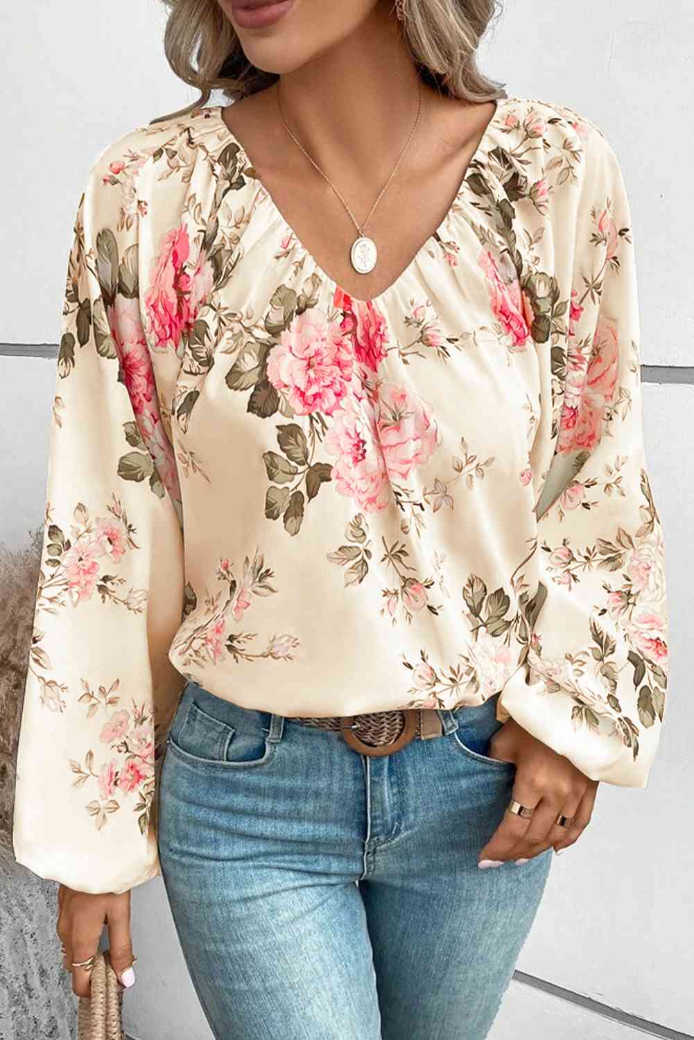 Floral V-neck balloon sleeve blouse.