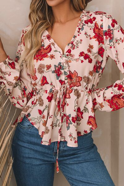 Floral V-neck drawstring peplum blouse.