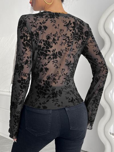 Floral V-neck long sleeve lace top.