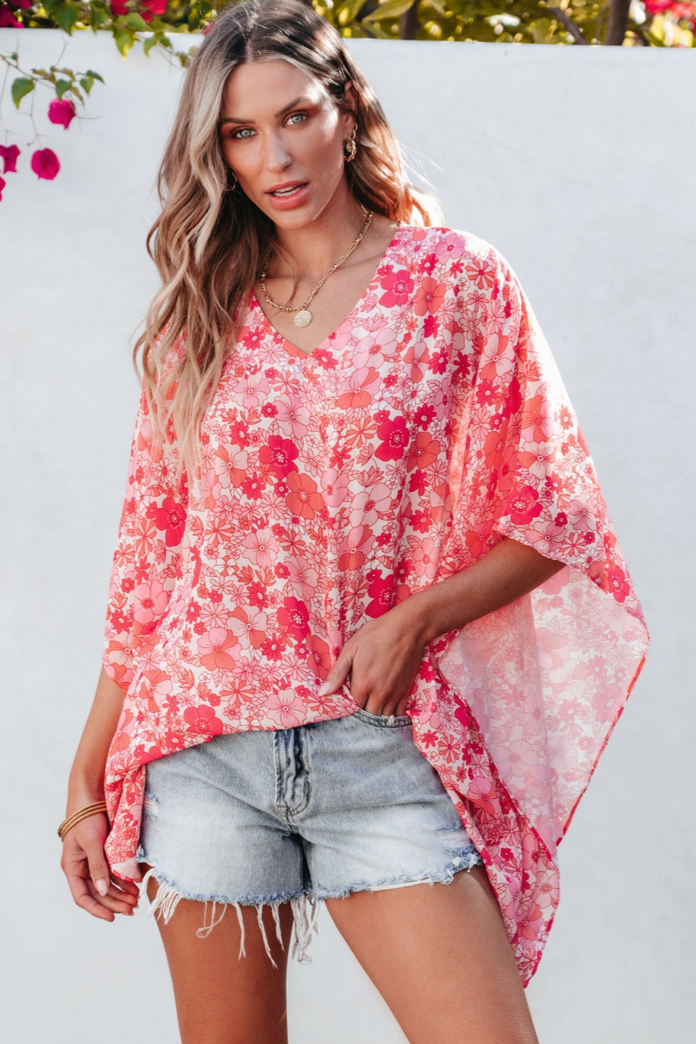 Floral V-neck three-quarter sleeve blouse.