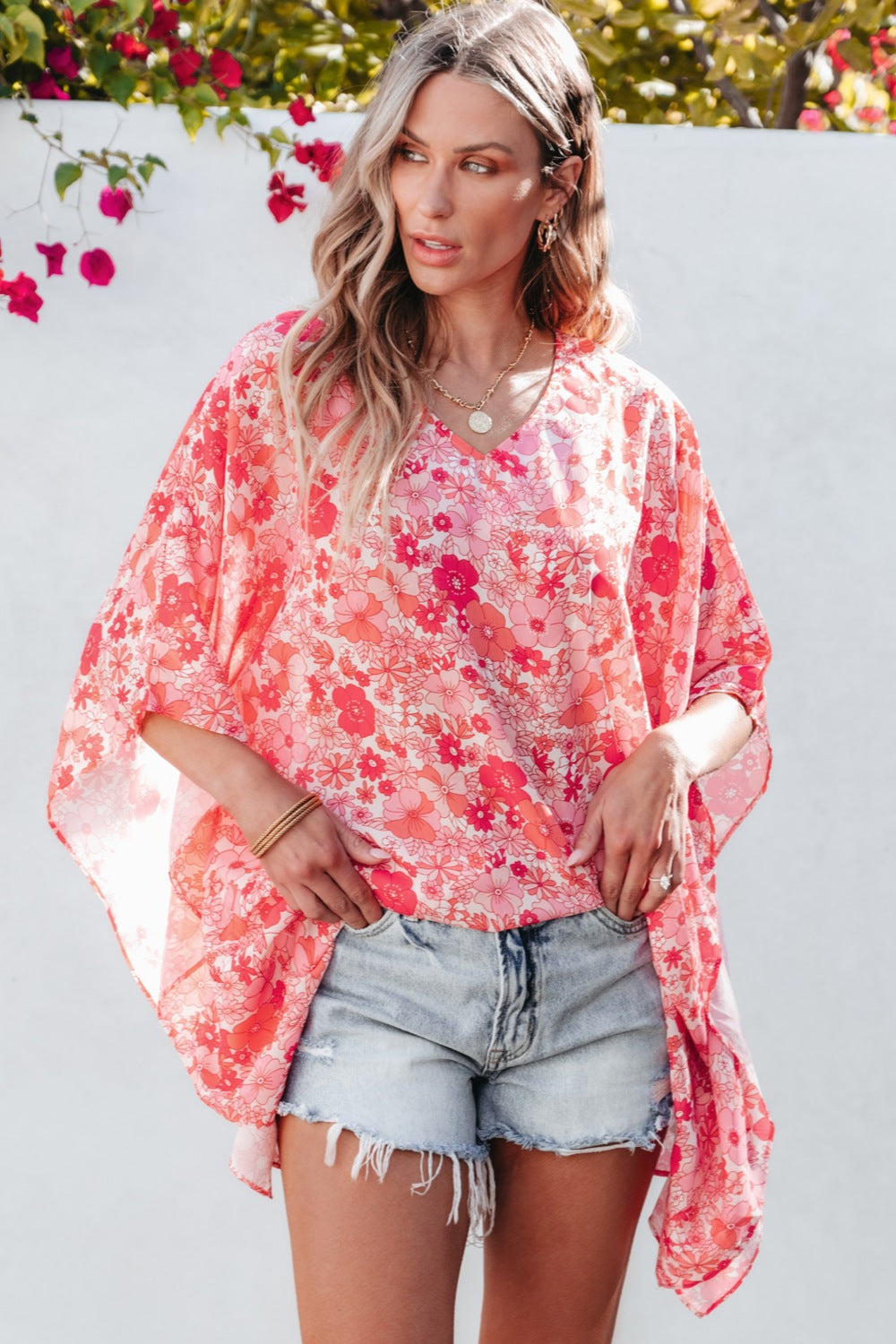 Floral V-neck three-quarter sleeve blouse.