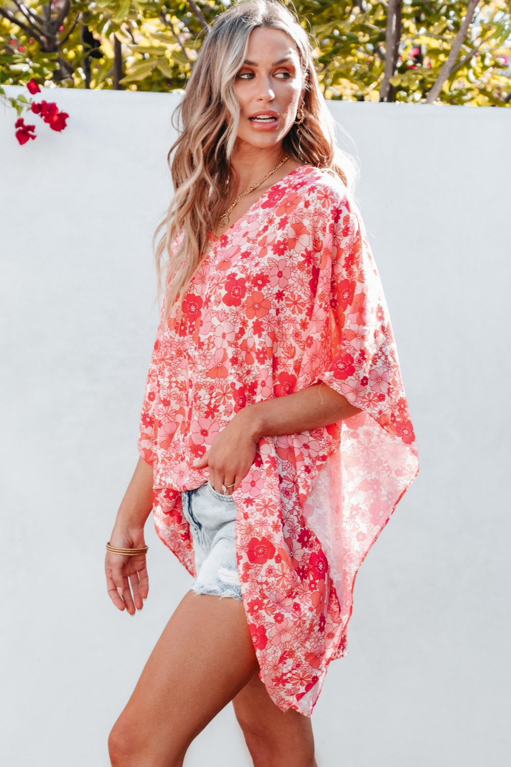 Floral V-neck three-quarter sleeve blouse.