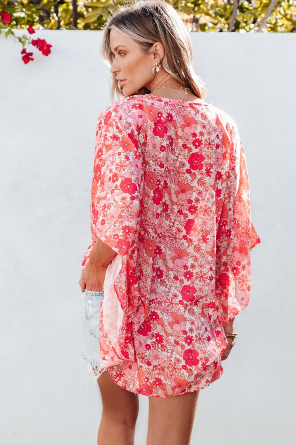 Floral V-neck three-quarter sleeve blouse.