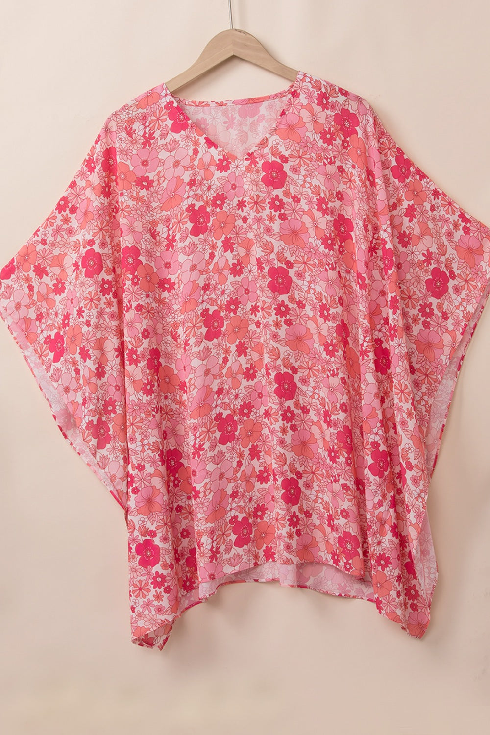 Floral V-neck three-quarter sleeve blouse.