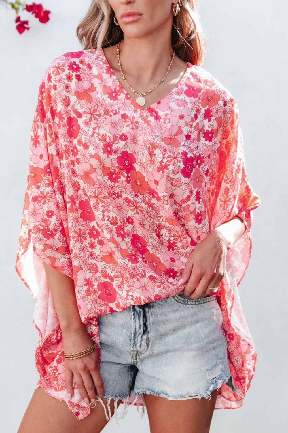 Floral V-neck three-quarter sleeve blouse.