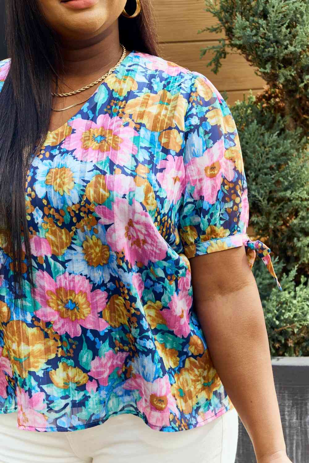 Petal Dew full size floral V-neck tie detail blouse.