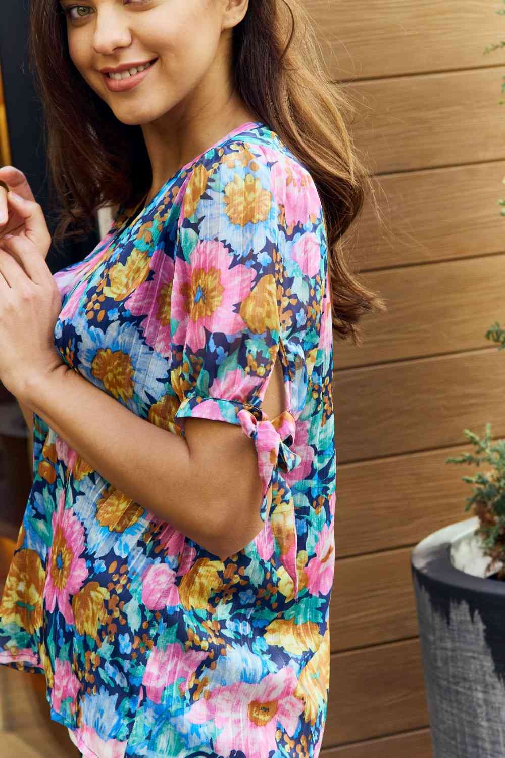 Petal Dew full size floral V-neck tie detail blouse.