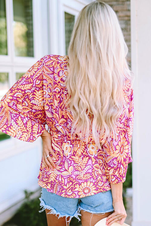 Floral V-neck tie front ruffled blouse.