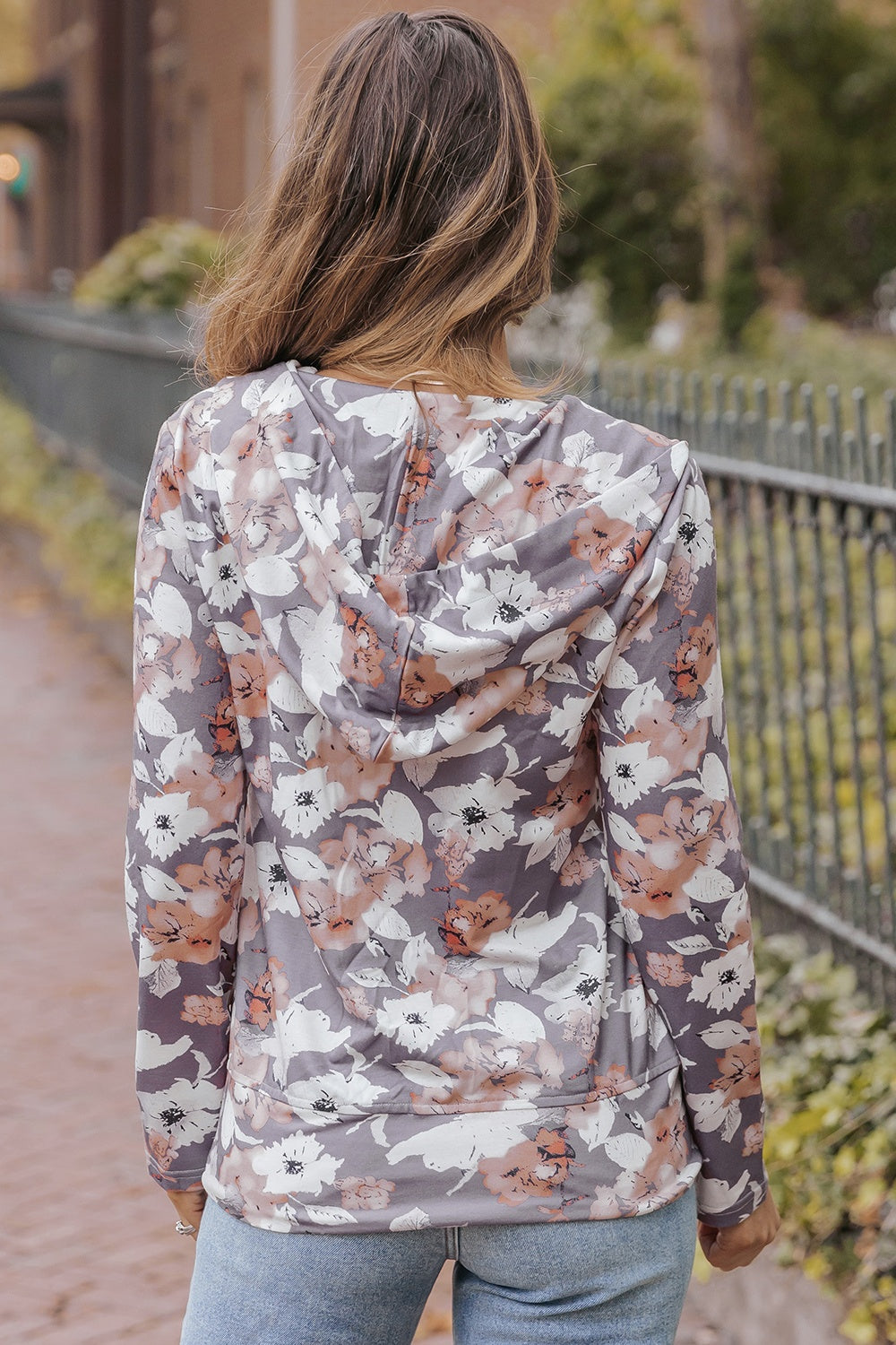 Floral zip up pocketed hoodie.