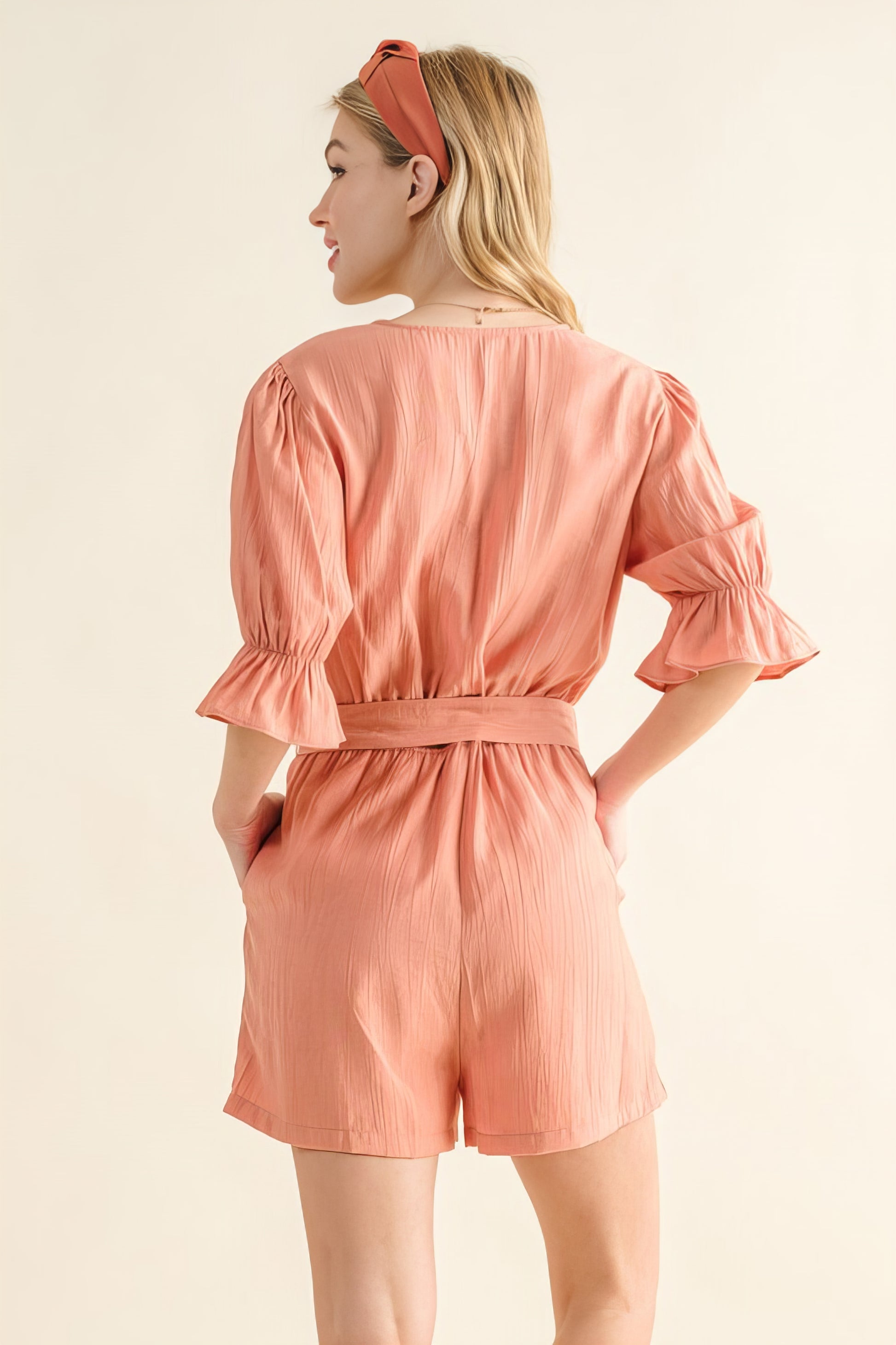 Flounce Sleeves Romper with Belt and Ruffled Details.
