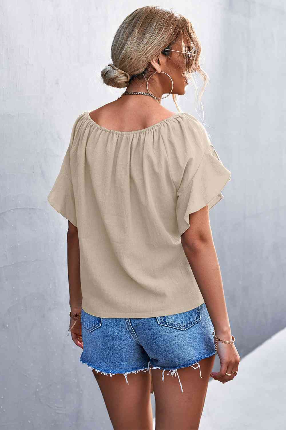Flutter sleeve tie-front blouse.