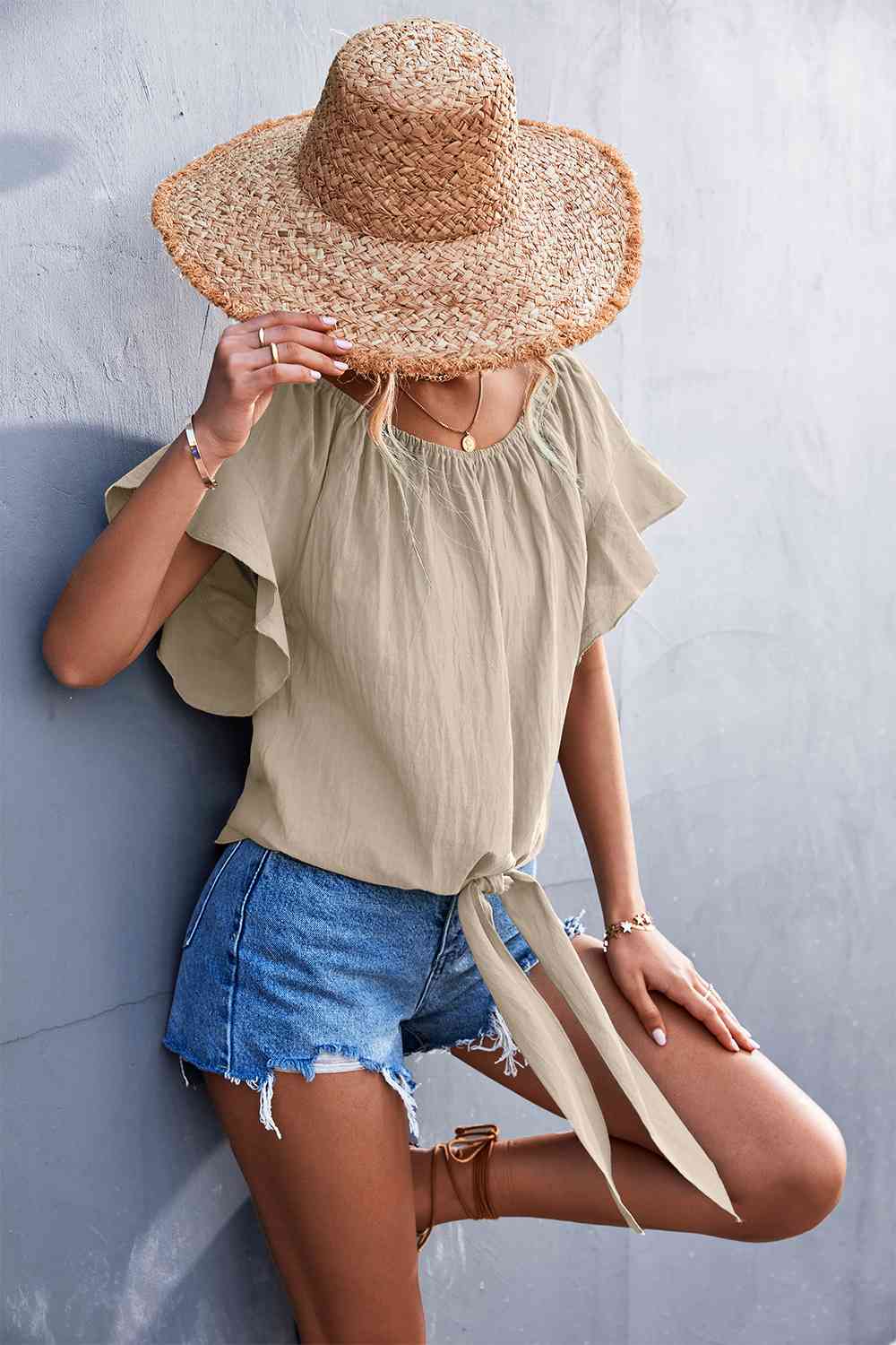 Flutter sleeve tie-front blouse.