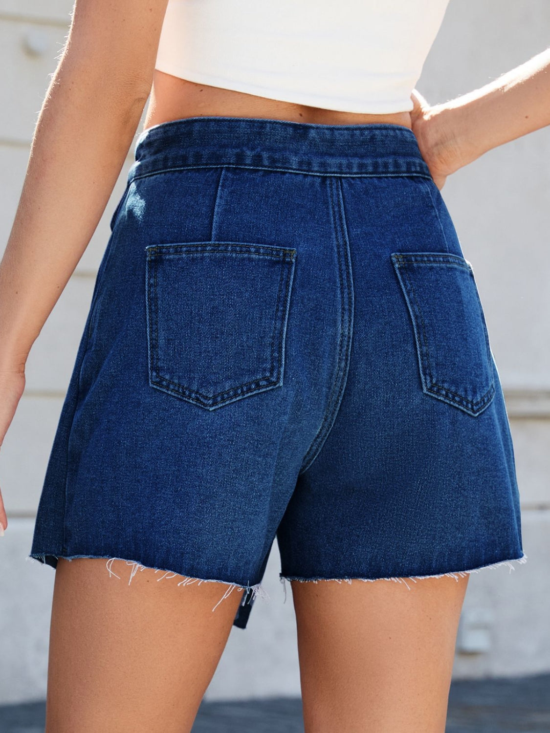 Frayed hem asymmetrical denim skort.