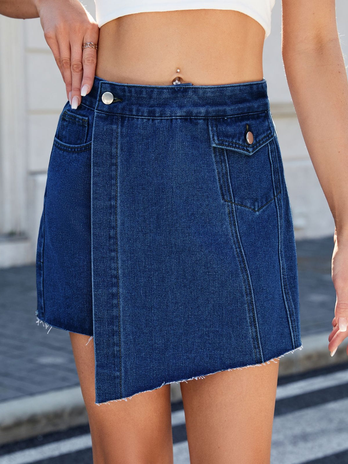 Frayed hem asymmetrical denim skort.