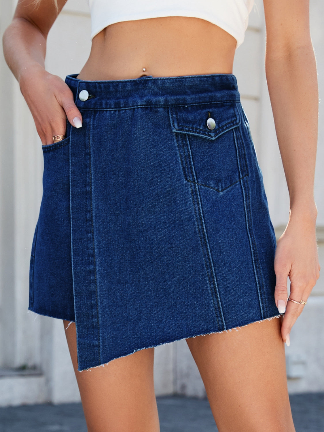 Frayed hem asymmetrical denim skort.
