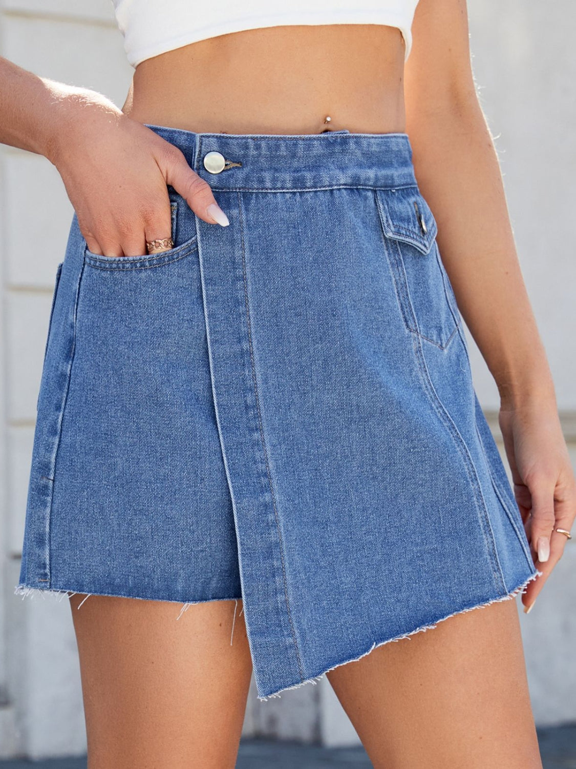 Frayed hem asymmetrical denim skort.