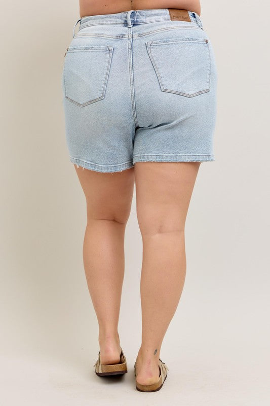 Plus size frayed hem high-rise denim shorts with pockets.