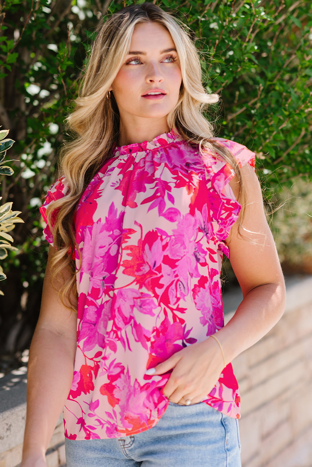 Frill floral mock neck cap sleeve blouse.