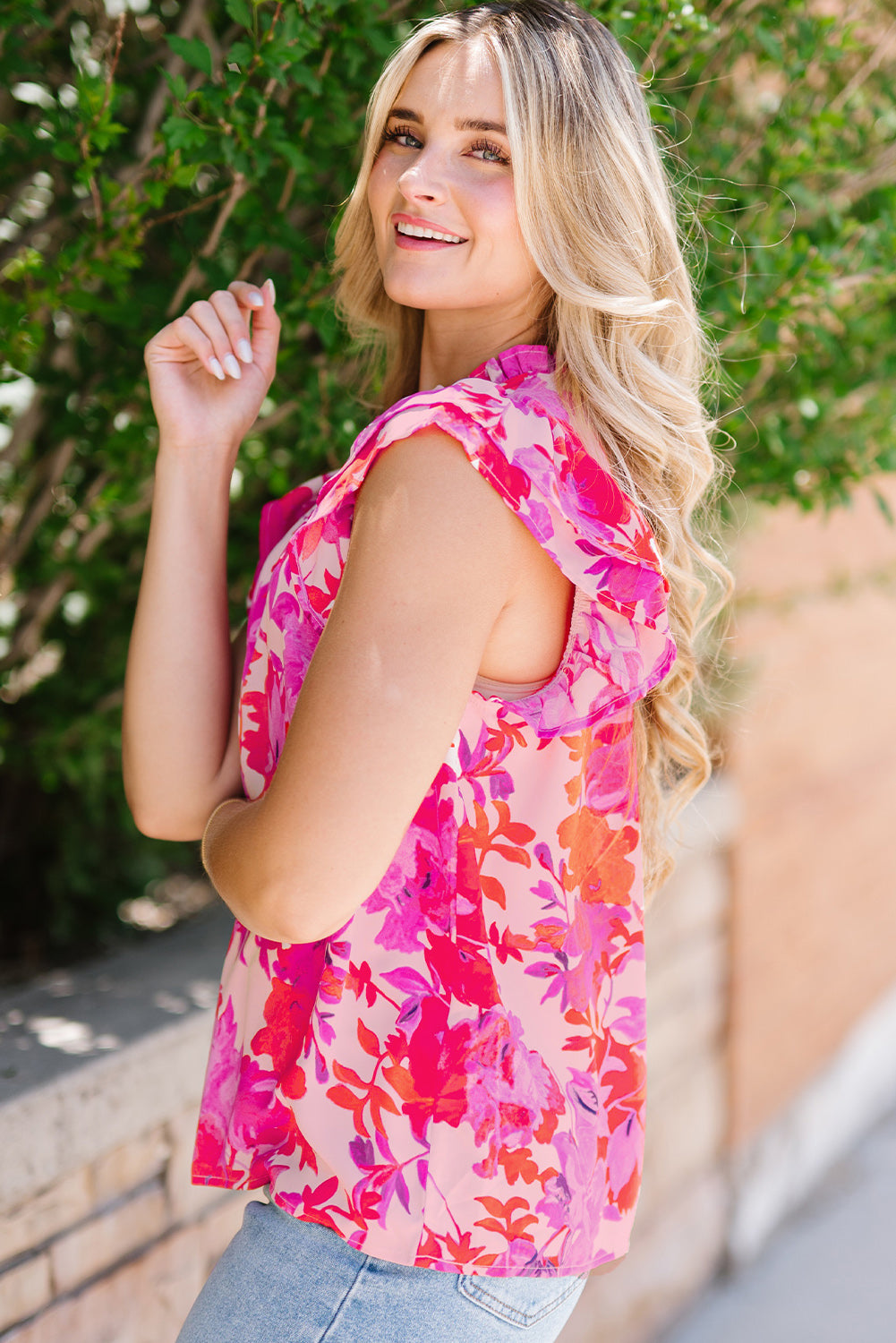 Frill floral mock neck cap sleeve blouse.