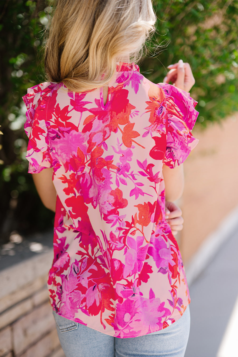 Frill floral mock neck cap sleeve blouse.
