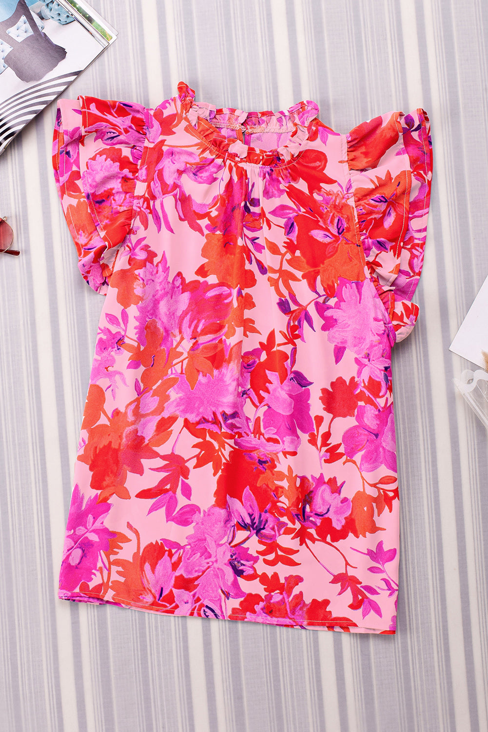 Frill floral mock neck cap sleeve blouse.