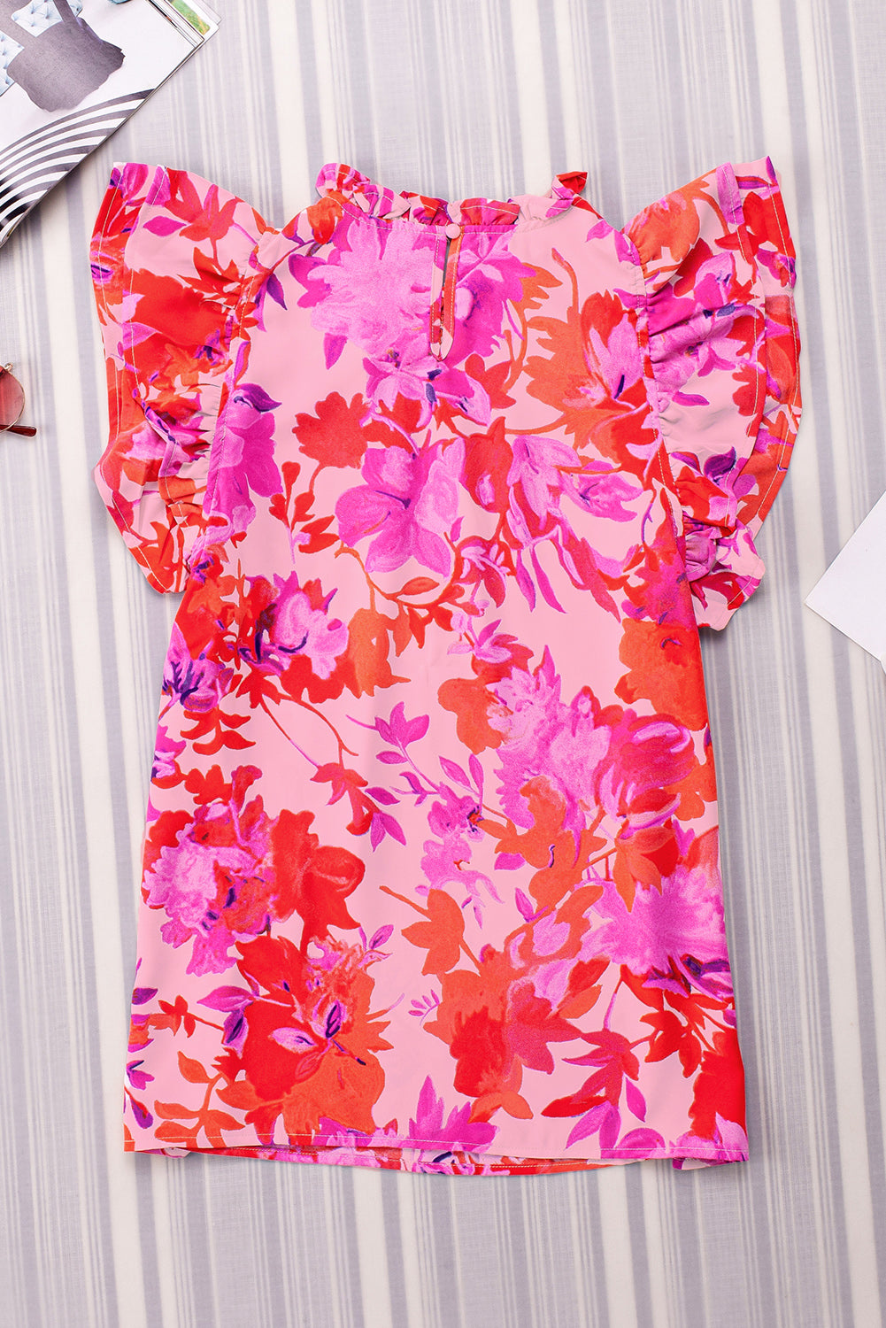 Frill floral mock neck cap sleeve blouse.