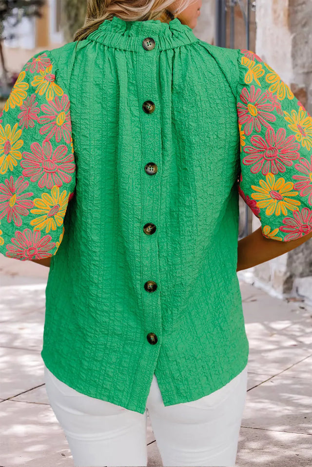 Frill mock neck puff sleeve blouse.