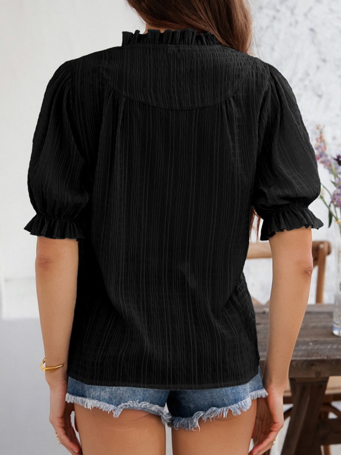 Devine frill notched short sleeve blouse.