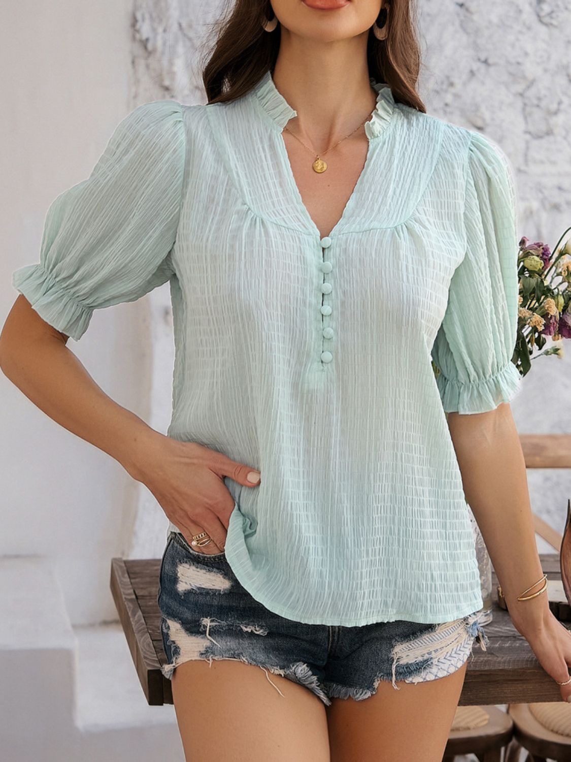 Devine frill notched short sleeve blouse.