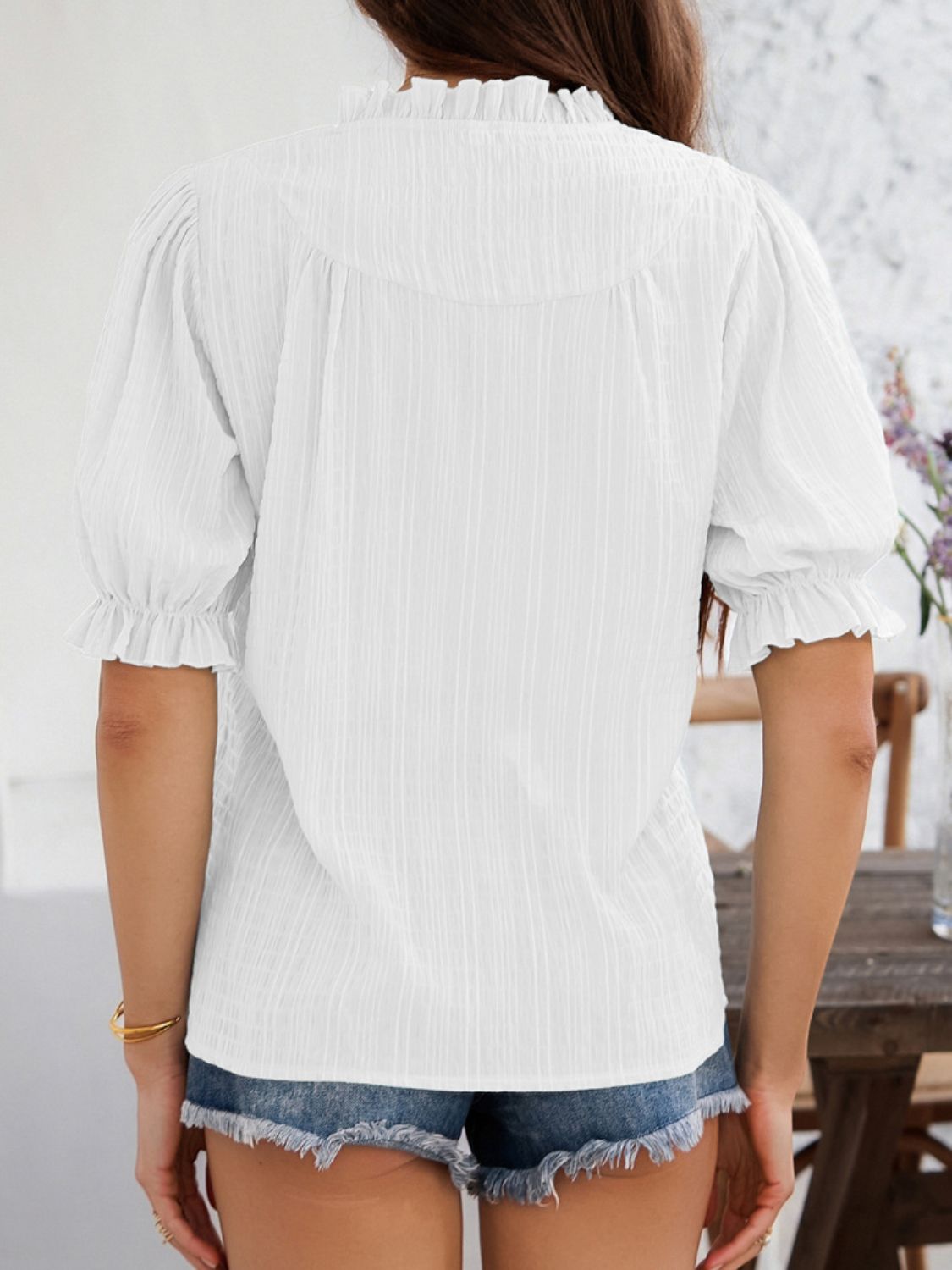 Devine frill notched short sleeve blouse.
