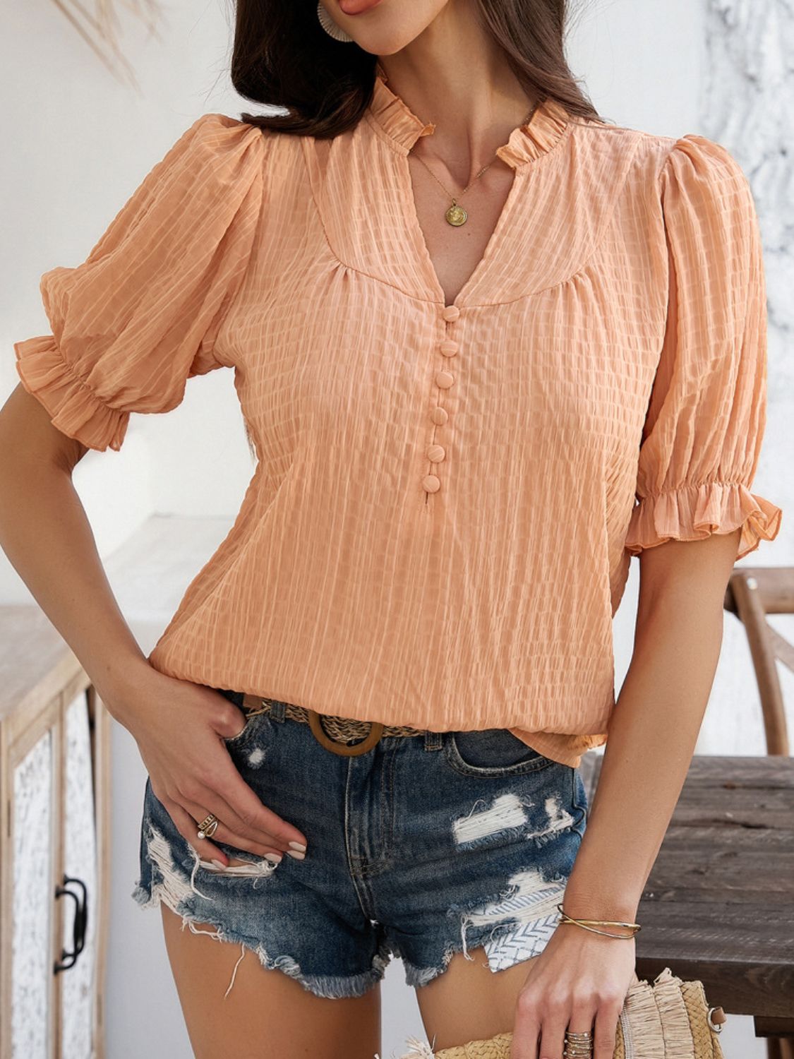 Devine frill notched short sleeve blouse.