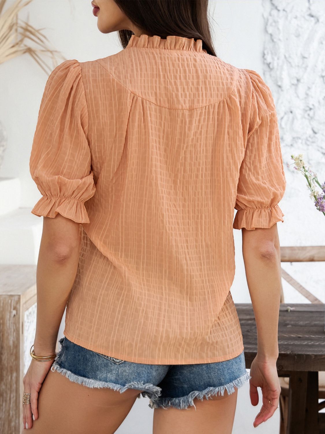 Devine frill notched short sleeve blouse.