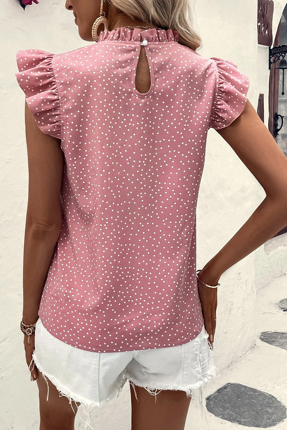 Frill polka dot cap sleeve blouse.