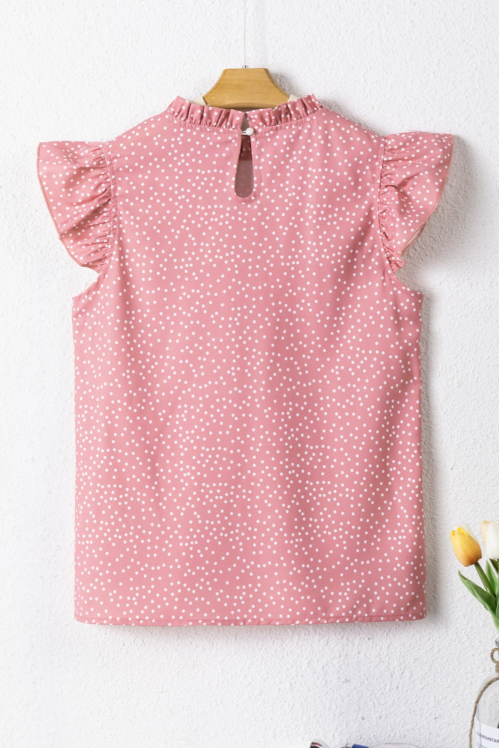 Frill polka dot cap sleeve blouse.