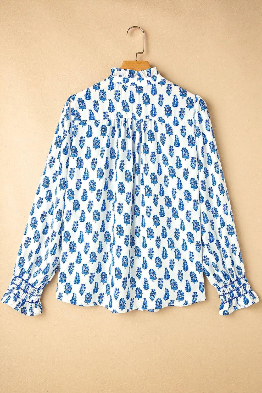 Frill printed button-up long sleeve shirt.