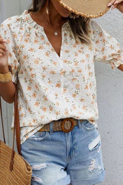 Frill printed notched short sleeve blouse.