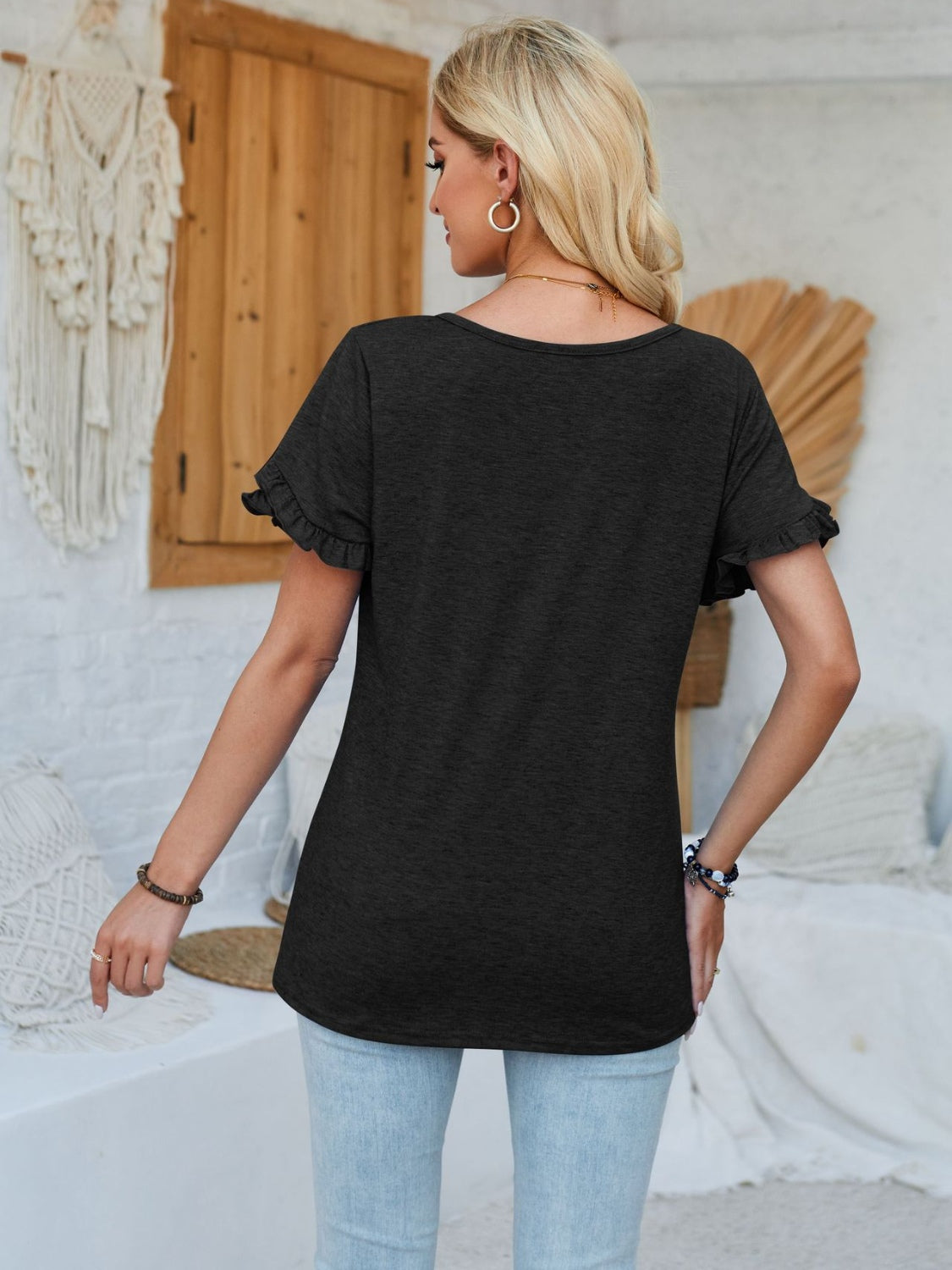 Frill round neck petal sleeve blouse.