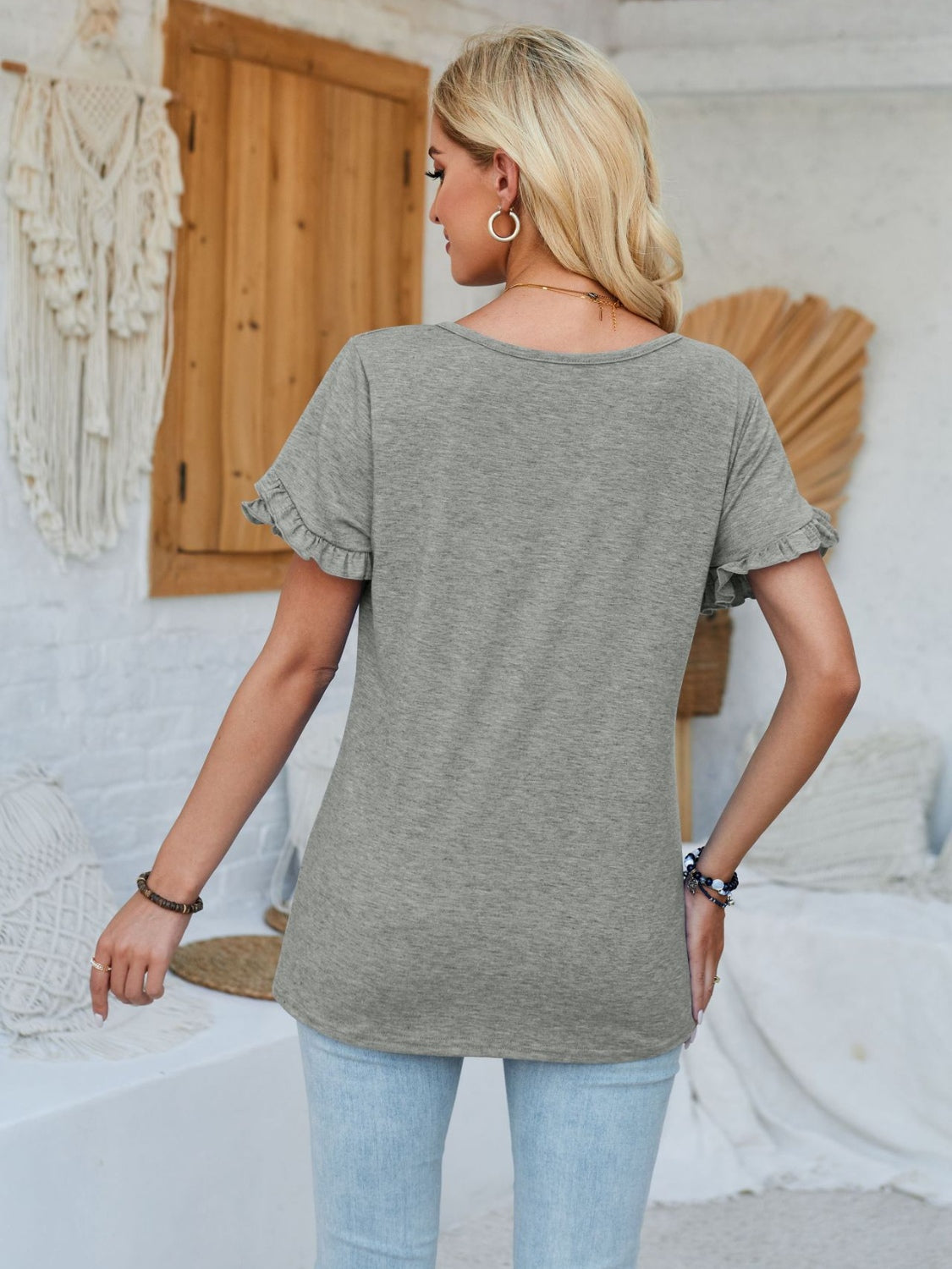 Frill round neck petal sleeve blouse.