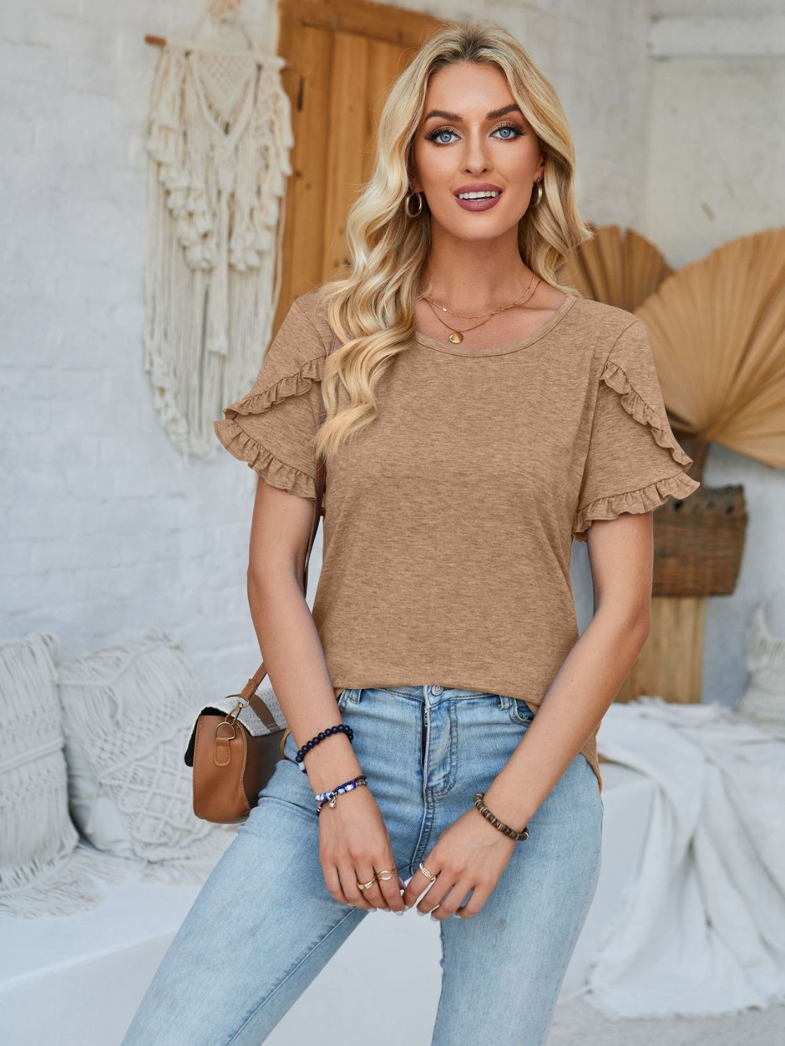 Frill round neck petal sleeve blouse.