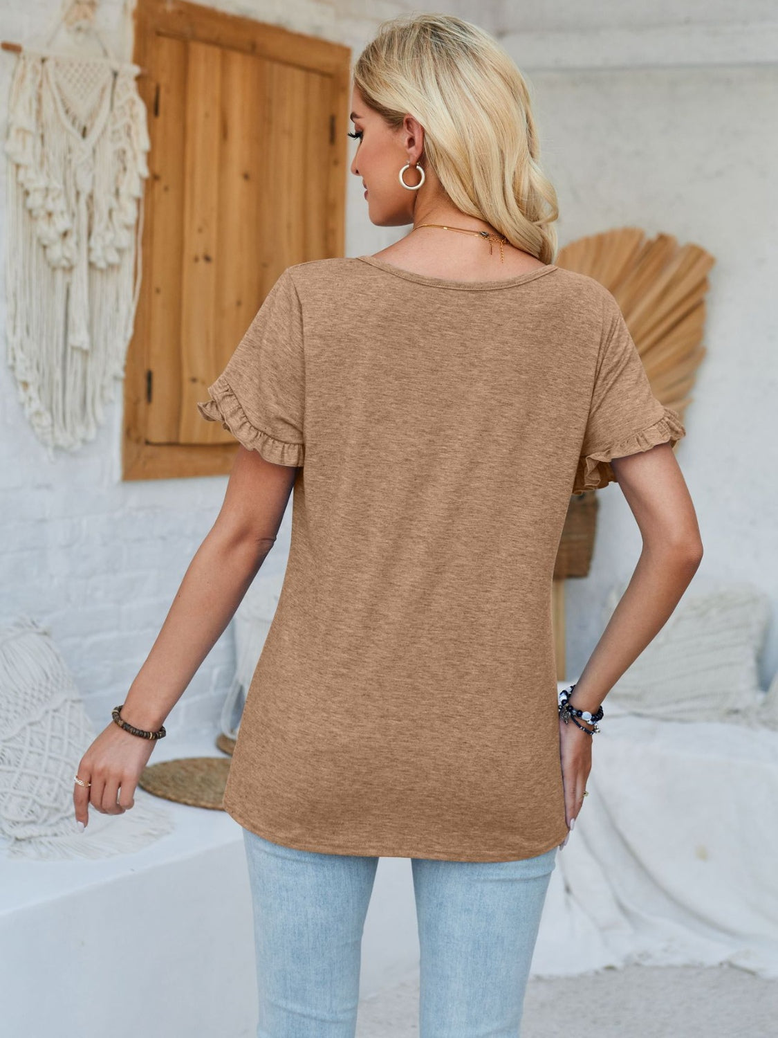 Frill round neck petal sleeve blouse.
